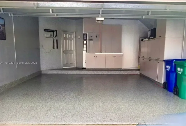 a view of a patio with a table and chairs