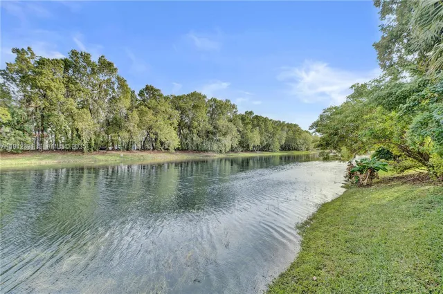 an aerial view of multiple houses with yard