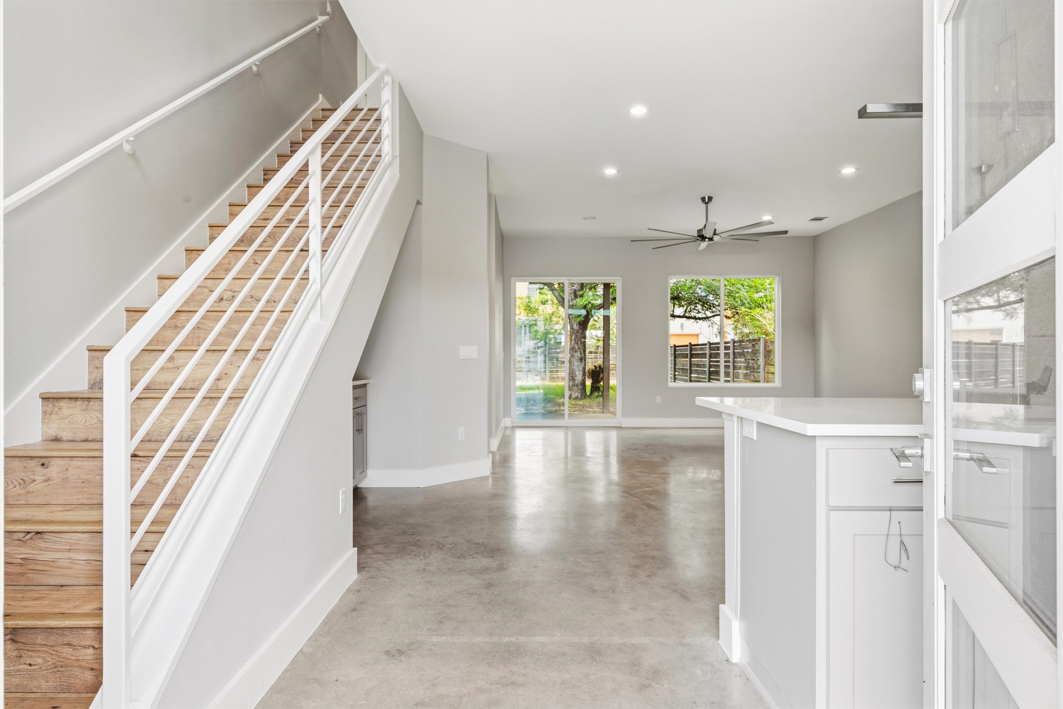 1210 Stobaugh Street, Unit B Austin, TX 78757 - Photo 35 of 40 Clean lines and a spacious layout define this modern living space, highlighted by abundant natural illumination.