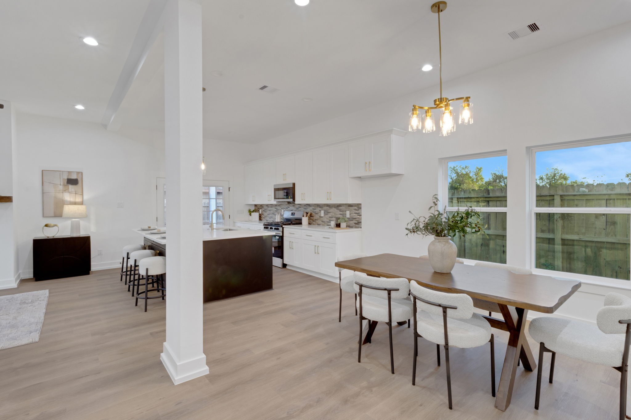 4202 Plaag Street Houston, TX 77016 - Photo 8 of 38 Open-concept design featuring a stylish kitchen with quartz countertops and a spacious dining area.