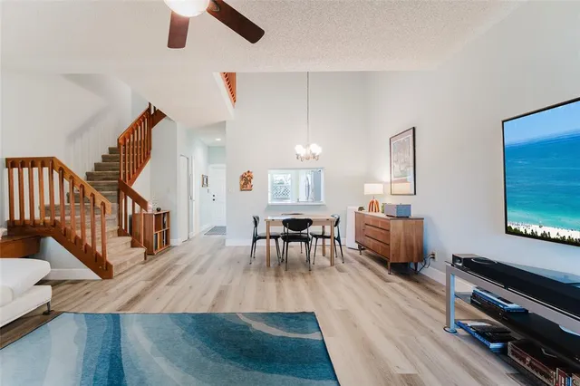a bathroom with a granite countertop sink mirror vanity and bathtub