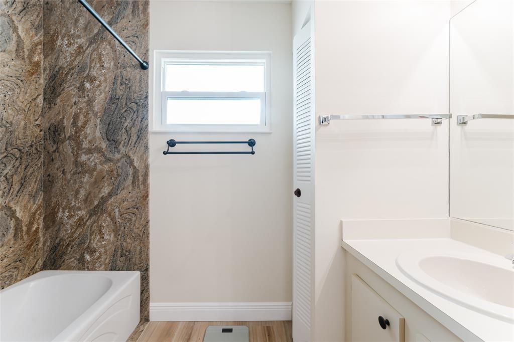 272 West Hemingway Circle Margate, FL 33063 - Photo 14 of 61 a bathroom with a granite countertop sink mirror vanity and bathtub