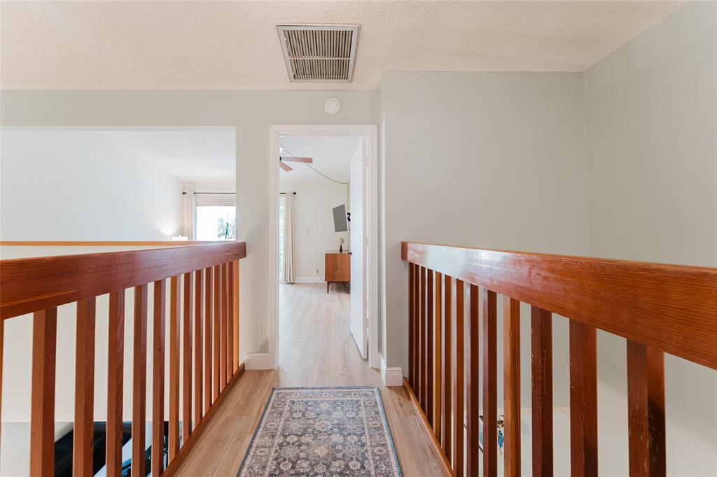 272 West Hemingway Circle Margate, FL 33063 - Photo 20 of 61 a view of a hallway with wooden floor and a bathroom