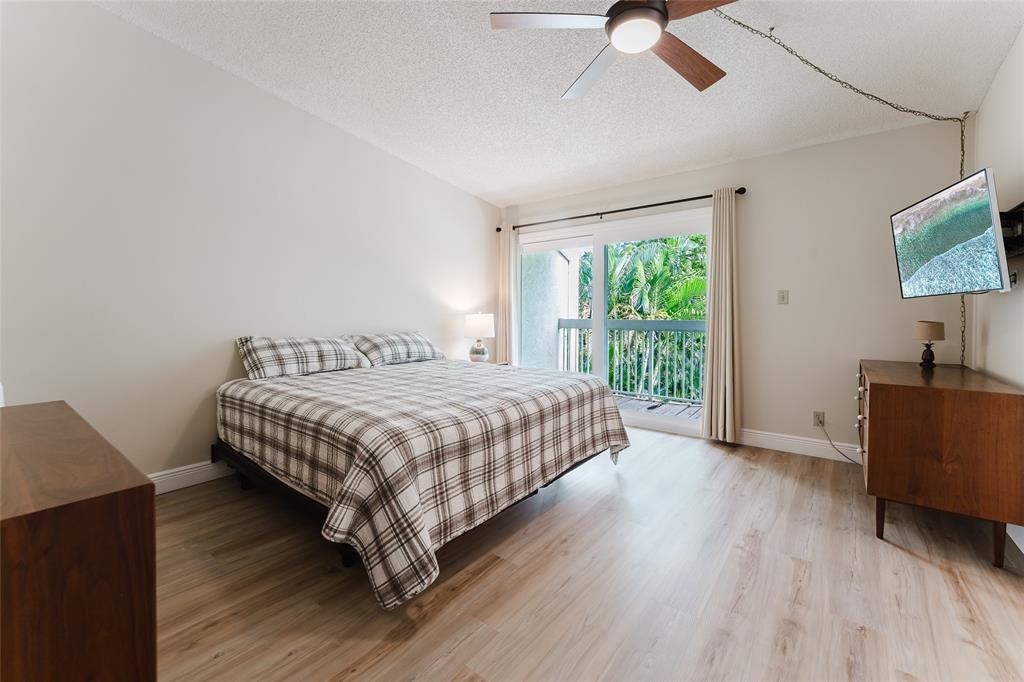 272 West Hemingway Circle Margate, FL 33063 - Photo 21 of 61 a bedroom with a bed and a flat screen tv