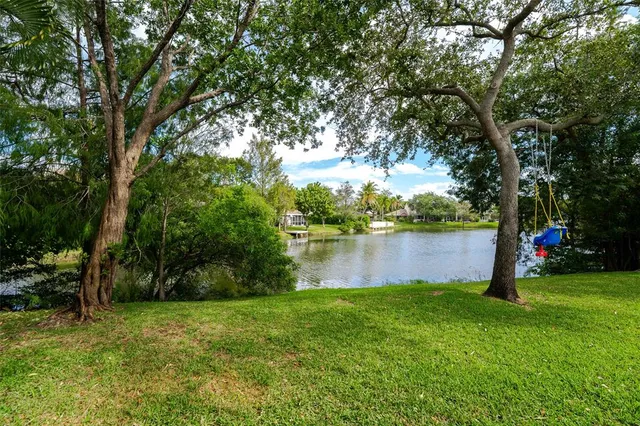 a view of swimming pool with chairs