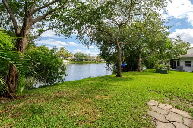 a view of a swimming pool with a patio