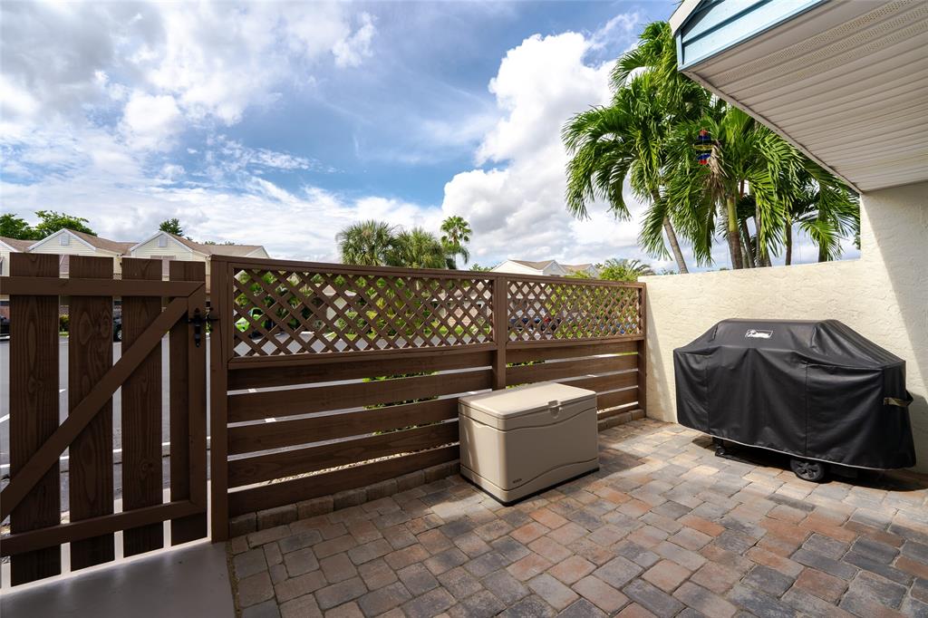 272 West Hemingway Circle Margate, FL 33063 - Photo 38 of 61 a view of a chairs and table in the back yard of the house
