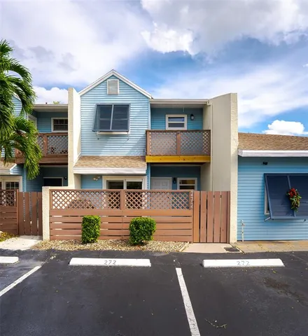a aerial view of a house with swimming pool and furniture