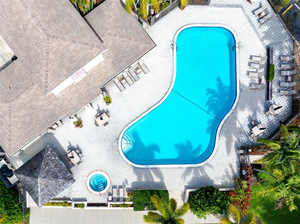 272 West Hemingway Circle Margate, FL 33063 - Photo 58 of 61 a view of a swimming pool with a outdoor seating and a swimming pool
