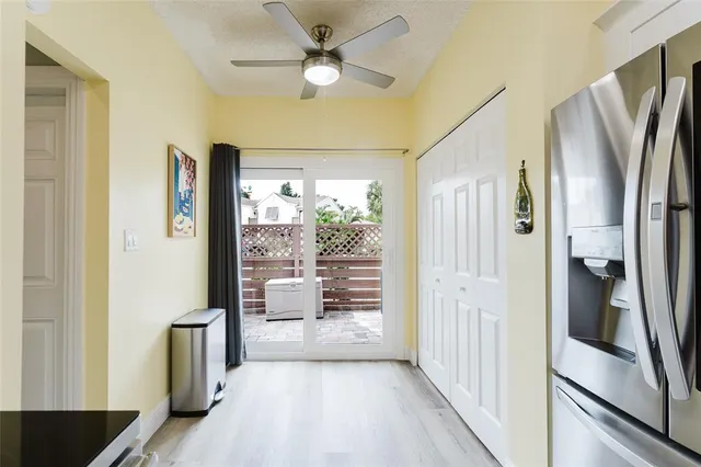 a kitchen with stainless steel appliances a refrigerator and a stove top oven