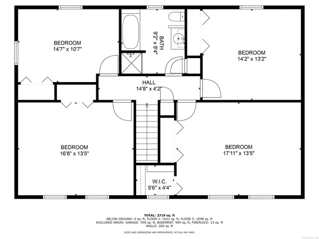 a view of a house with backyard and a tree