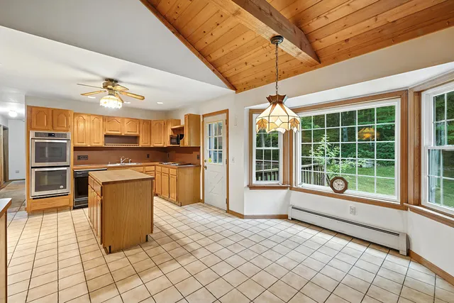 a kitchen with sink cabinets and outdoor view