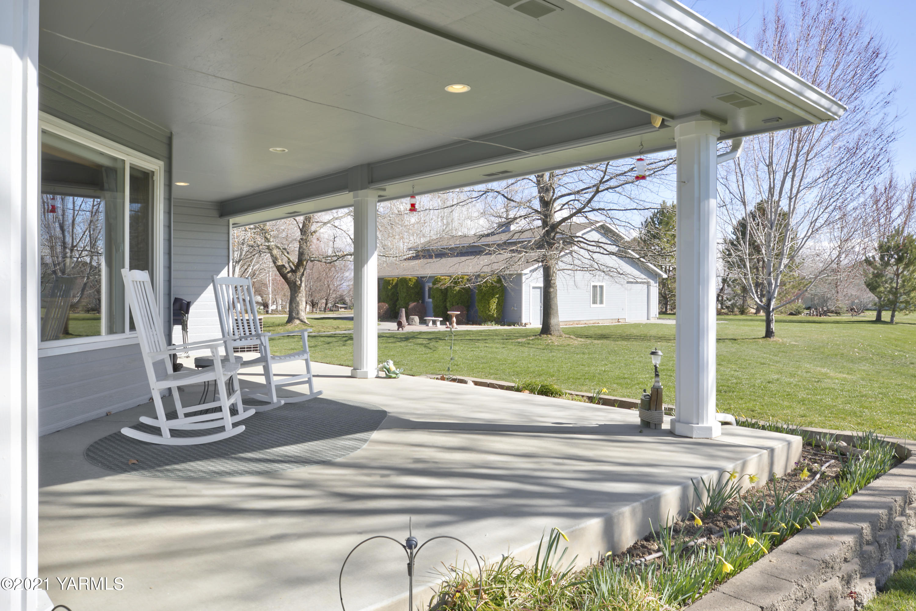 15016 Fisk Road Yakima, WA 98908 - Photo 8 of 29 a view of a house with backyard porch and garden
