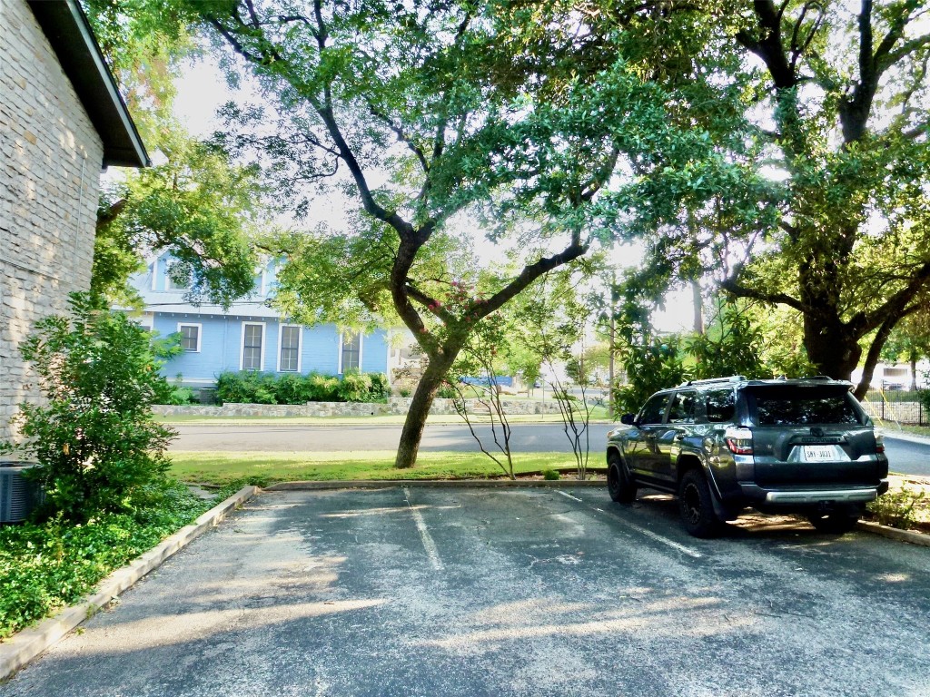 601 Hearn Street, Unit 207 Austin, TX 78703 - Photo 25 of 40 a view of a yard with car parked