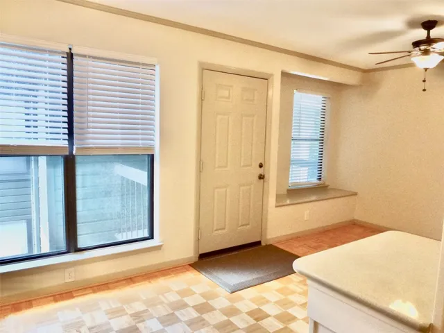 a view of a room that has a window in it