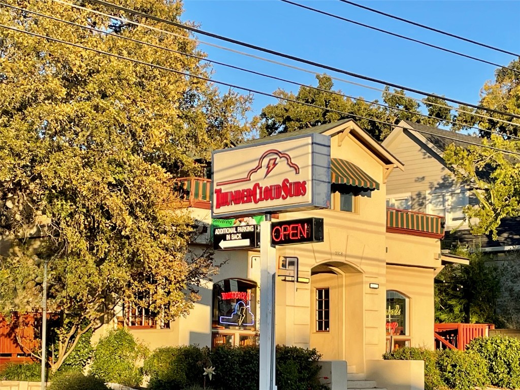 601 Hearn Street, Unit 207 Austin, TX 78703 - Photo 37 of 40 a street sign on a wall next to a road