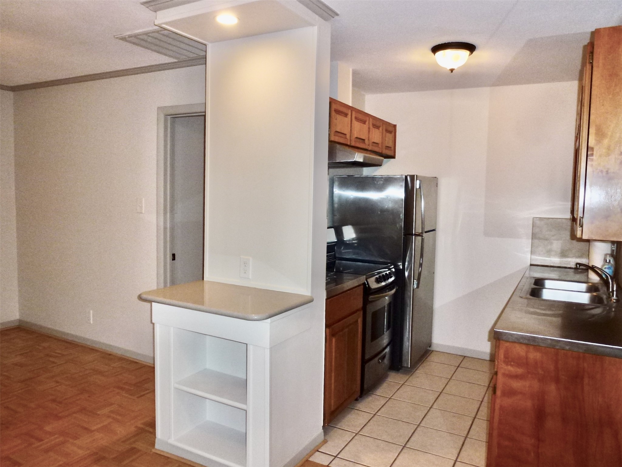 601 Hearn Street, Unit 207 Austin, TX 78703 - Photo 5 of 40 a kitchen with a refrigerator stove and sink