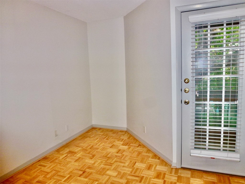 601 Hearn Street, Unit 207 Austin, TX 78703 - Photo 9 of 40 a view of empty room with windows