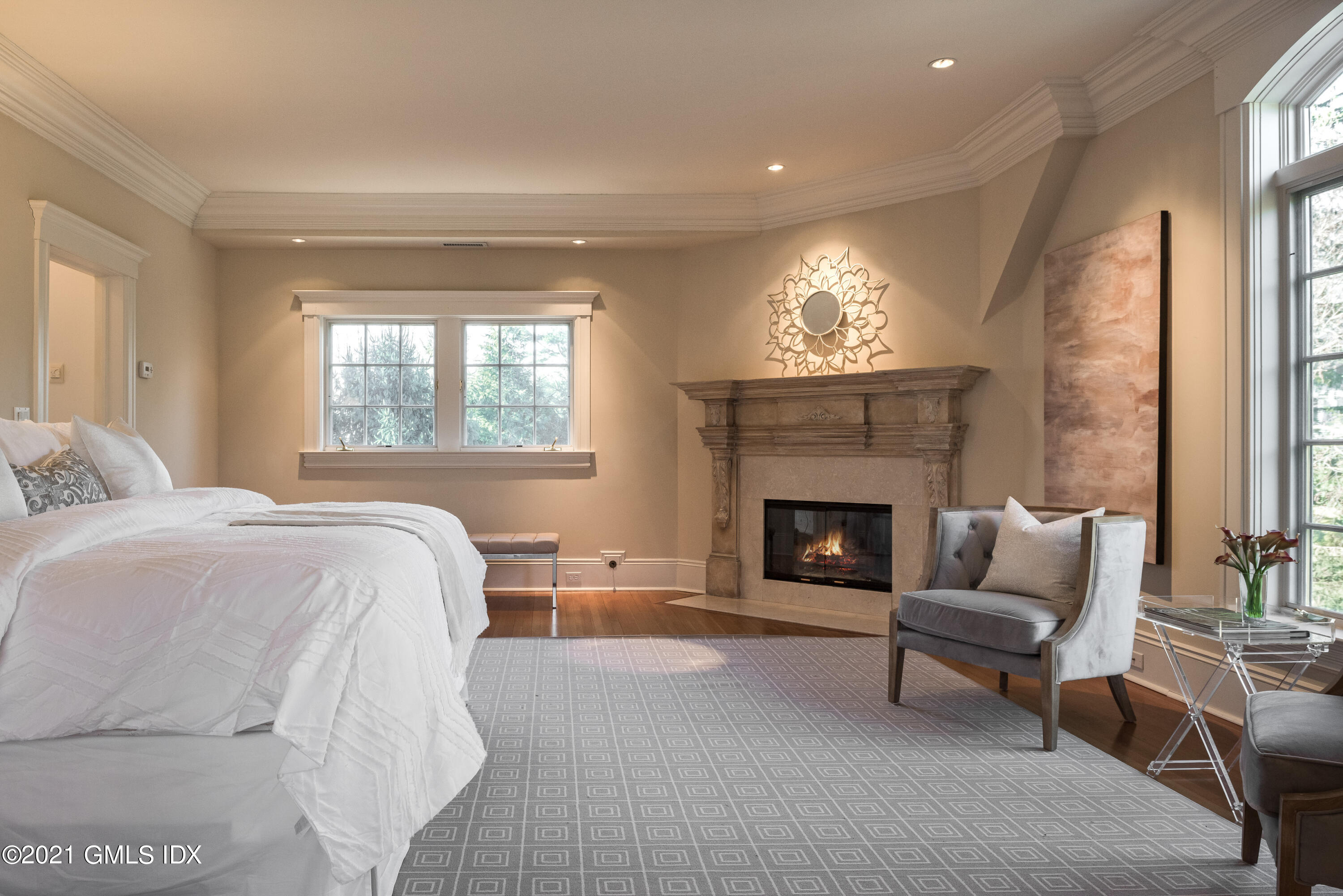 8 Hillside Drive Greenwich, CT 06831 - Photo 17 of 30 a spacious bedroom with a bed and a fireplace