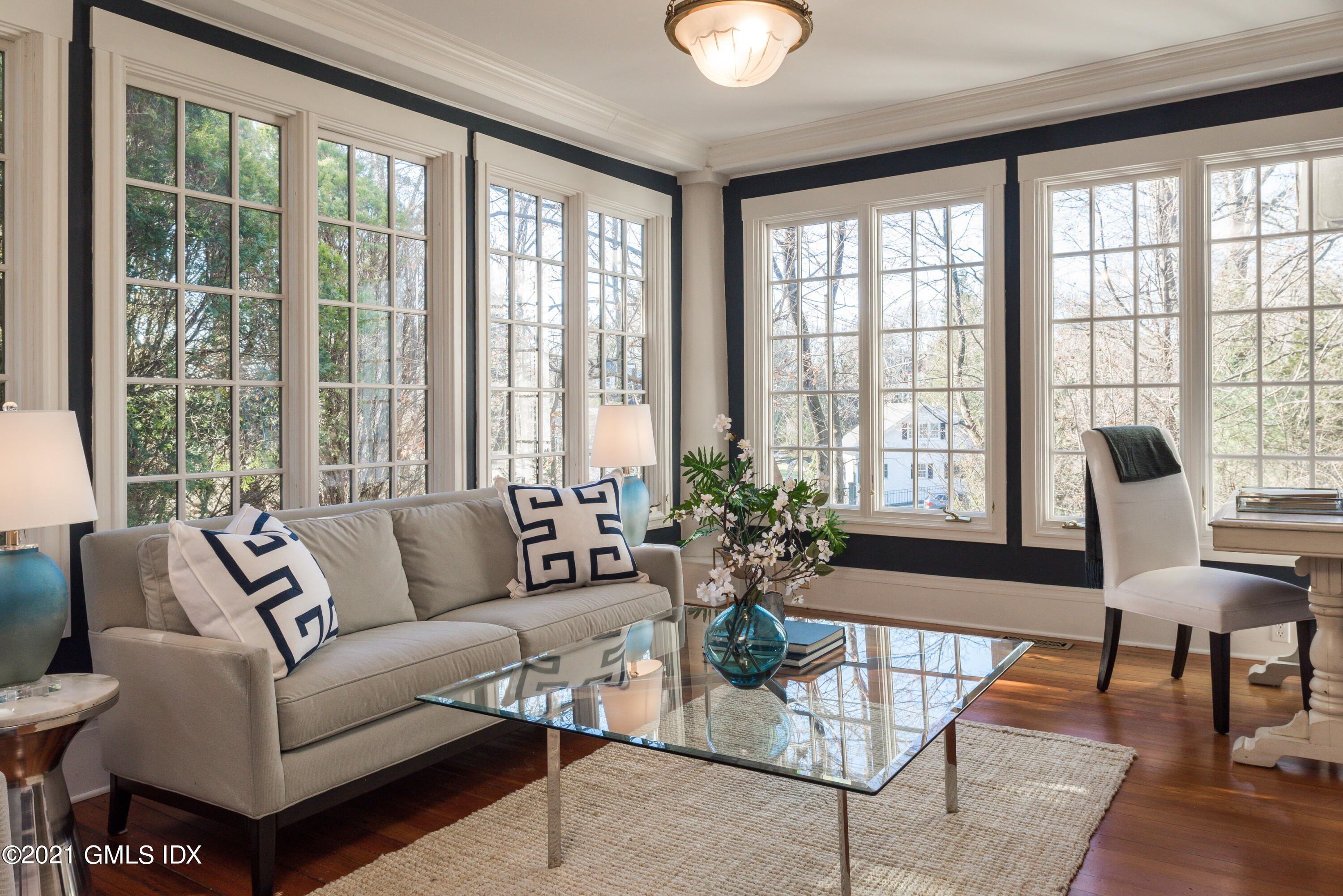 8 Hillside Drive Greenwich, CT 06831 - Photo 7 of 30 a living room with furniture and floor to ceiling windows