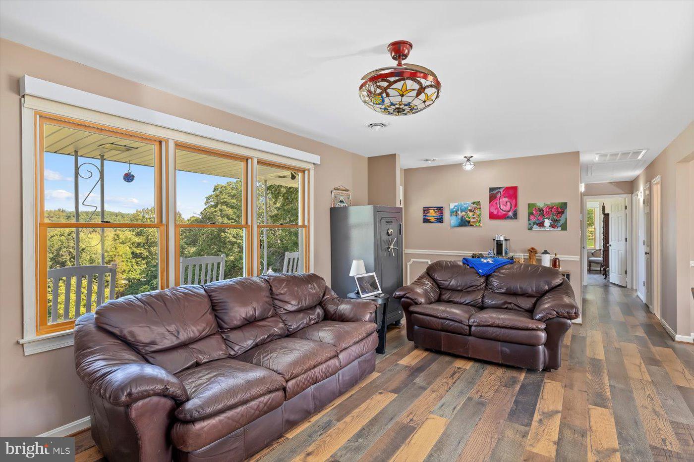 436 Castleton View Road Castleton, VA 22716 - Photo 11 of 66 a living room with furniture and a large window