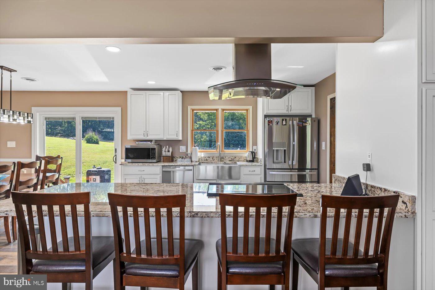 436 Castleton View Road Castleton, VA 22716 - Photo 13 of 66 a view of a chairs and table in a kitchen
