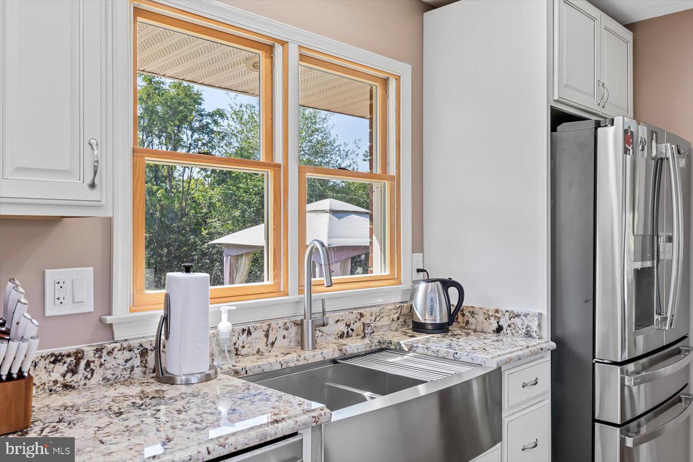 436 Castleton View Road Castleton, VA 22716 - Photo 17 of 66 a kitchen with stainless steel appliances granite countertop a sink stove and refrigerator