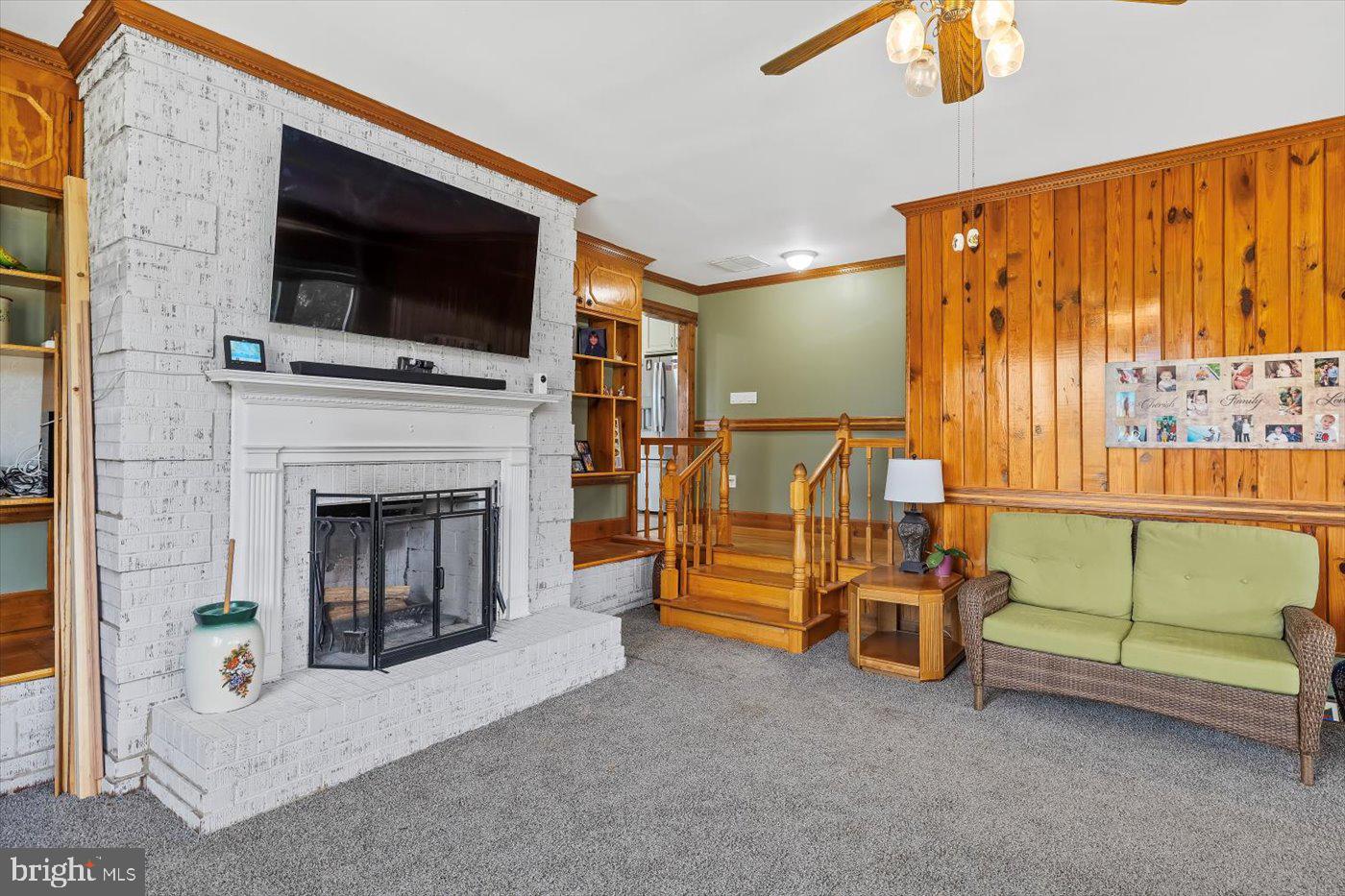 436 Castleton View Road Castleton, VA 22716 - Photo 22 of 66 a living room with furniture a flat screen tv and a fireplace