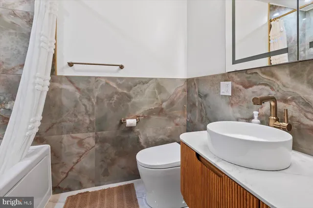 a view of a room with wooden floor and windows