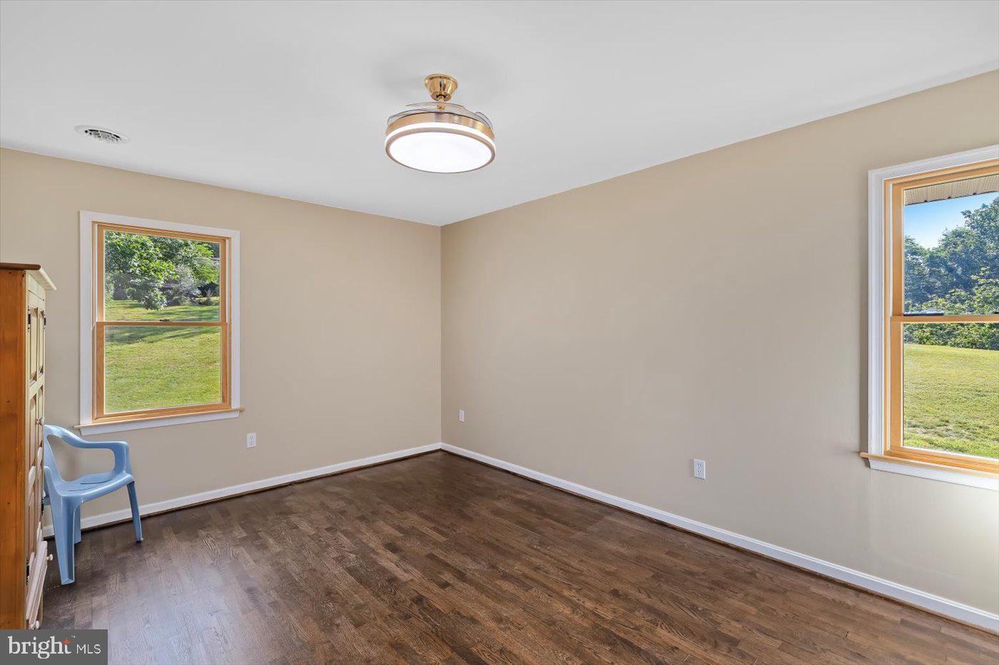 436 Castleton View Road Castleton, VA 22716 - Photo 30 of 66 a view of a room with wooden floor and windows