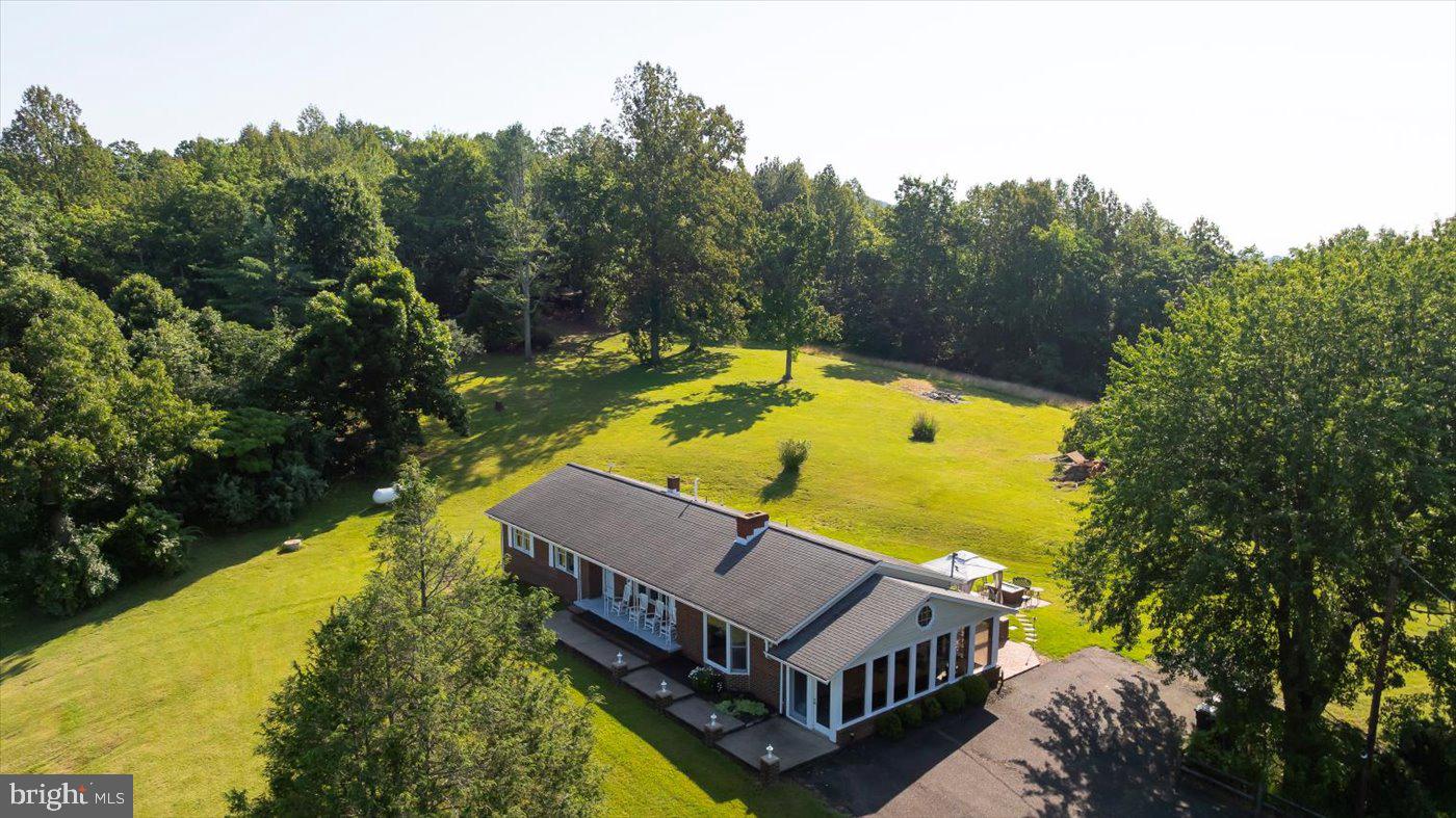 436 Castleton View Road Castleton, VA 22716 - Photo 51 of 66 a view of a swimming pool with a garden
