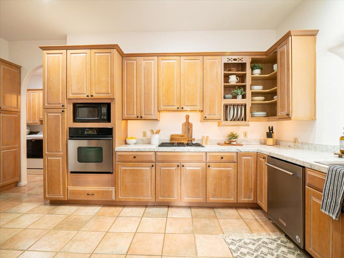 1910 Tularosa Road Lompoc, CA 93436 - Photo 11 of 55 a kitchen with stainless steel appliances granite countertop a stove a sink and a microwave