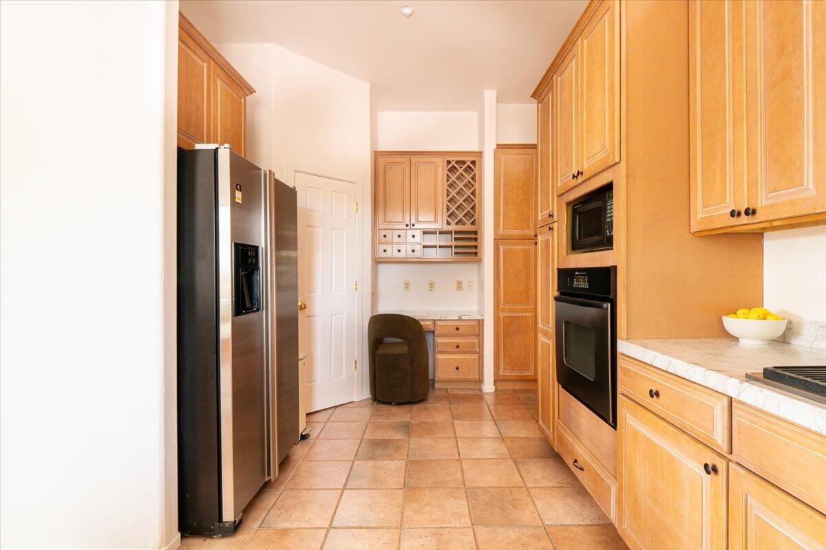 1910 Tularosa Road Lompoc, CA 93436 - Photo 15 of 55 a kitchen with stainless steel appliances a refrigerator and cabinets