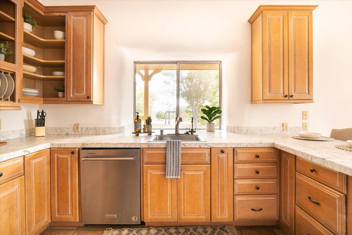 1910 Tularosa Road Lompoc, CA 93436 - Photo 20 of 55 a kitchen with cabinets appliances and a window