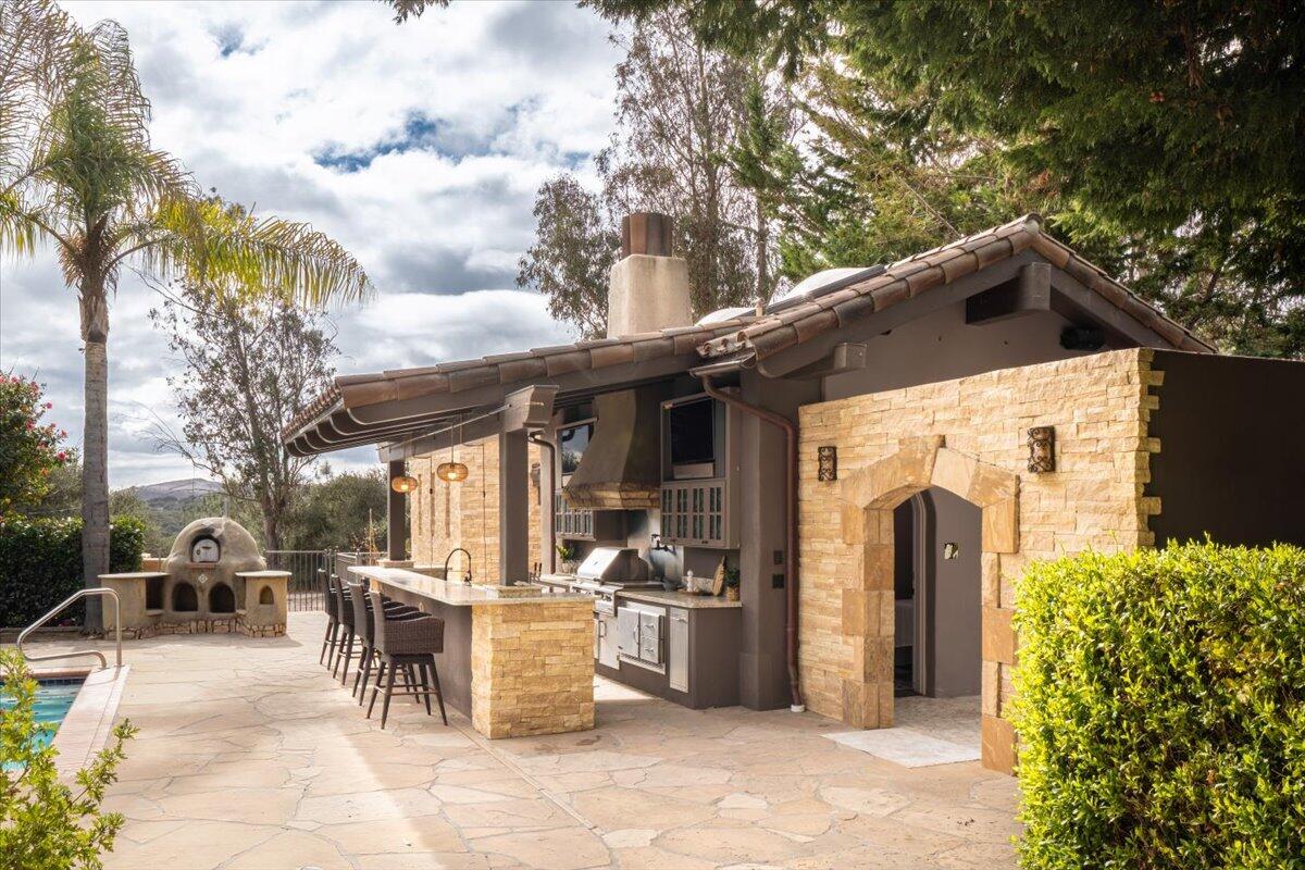 1910 Tularosa Road Lompoc, CA 93436 - Photo 30 of 55 a view of a patio with table and chairs and potted plants