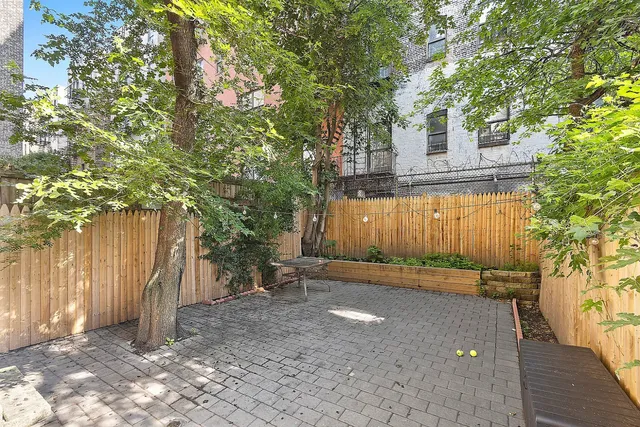 a view of building with large trees