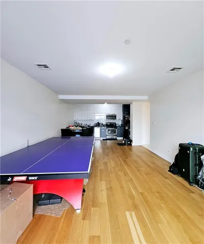 a room with a bed and a lamp