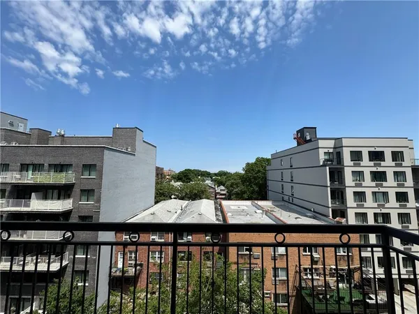 a balcony view with two chairs