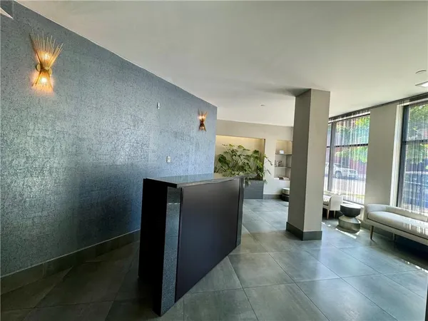 a living room with furniture and windows