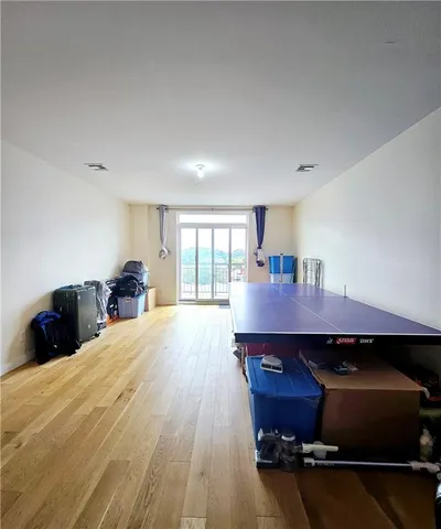 a bed room with a bed and a window