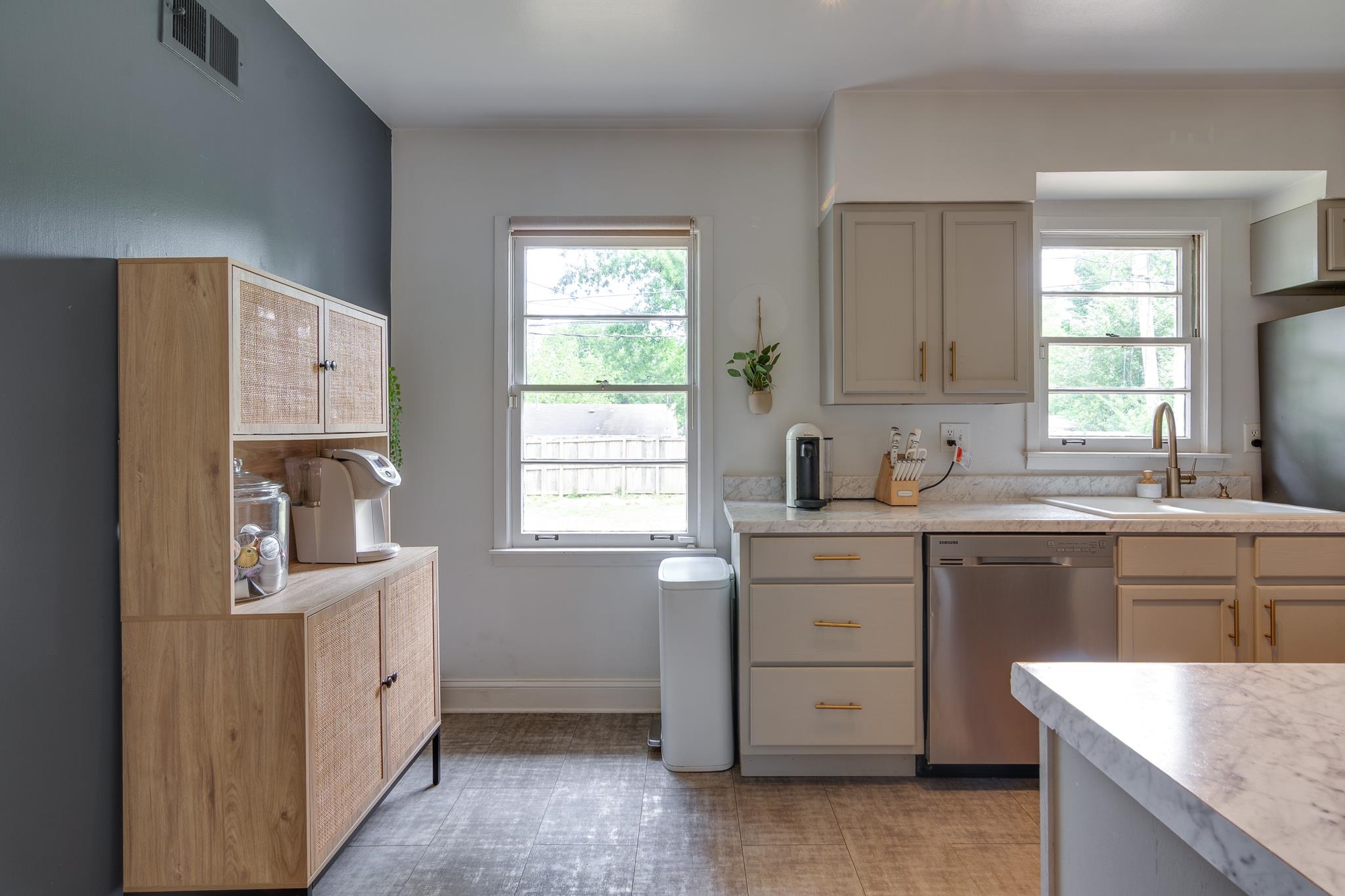 4952 Mockingbird Lane Memphis, TN 38117 - Photo 12 of 28 a kitchen with cabinets appliances and a window