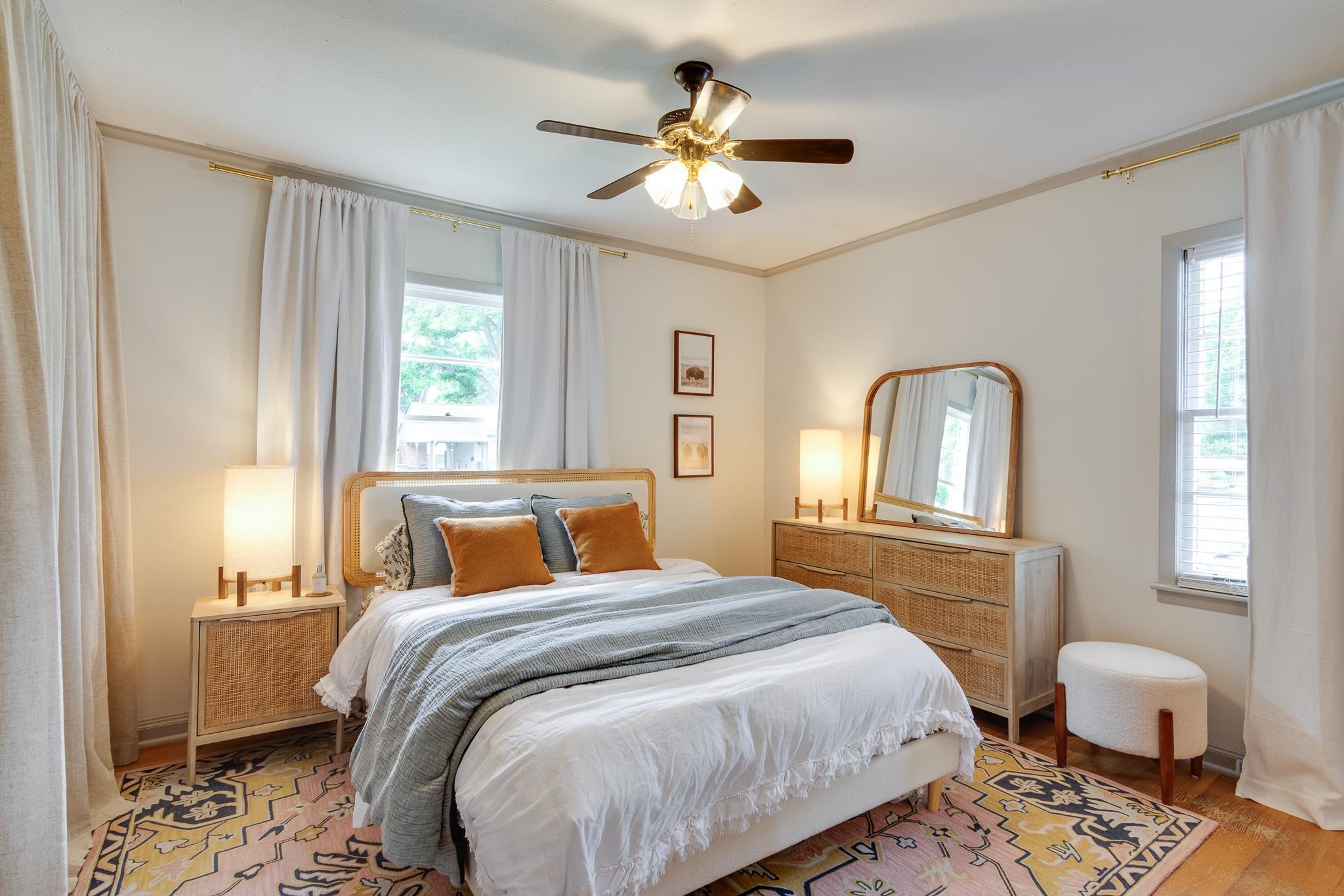 4952 Mockingbird Lane Memphis, TN 38117 - Photo 18 of 28 a bedroom with a large bed and wooden floor
