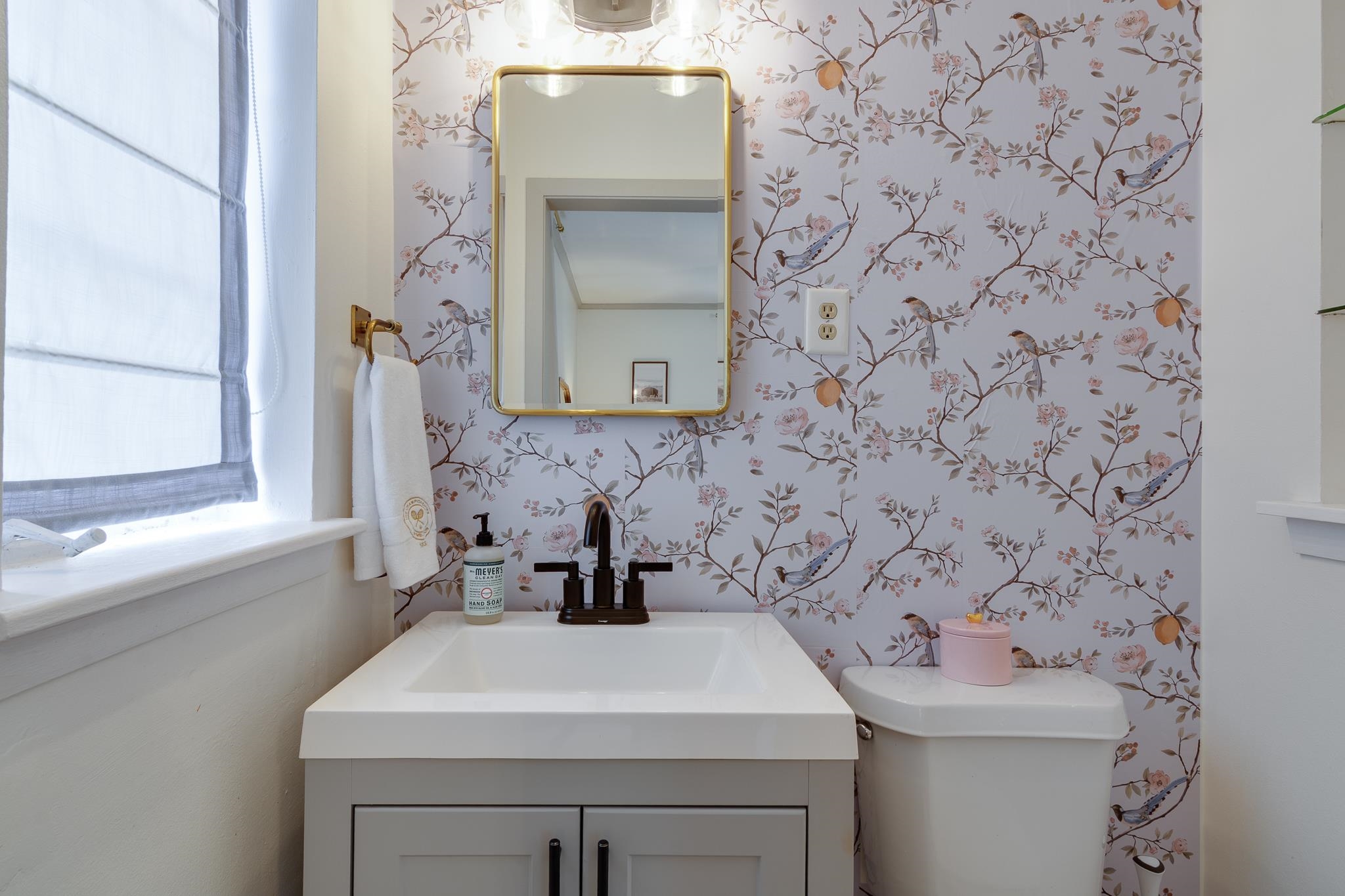 4952 Mockingbird Lane Memphis, TN 38117 - Photo 20 of 28 a bathroom with a sink a toilet and mirror