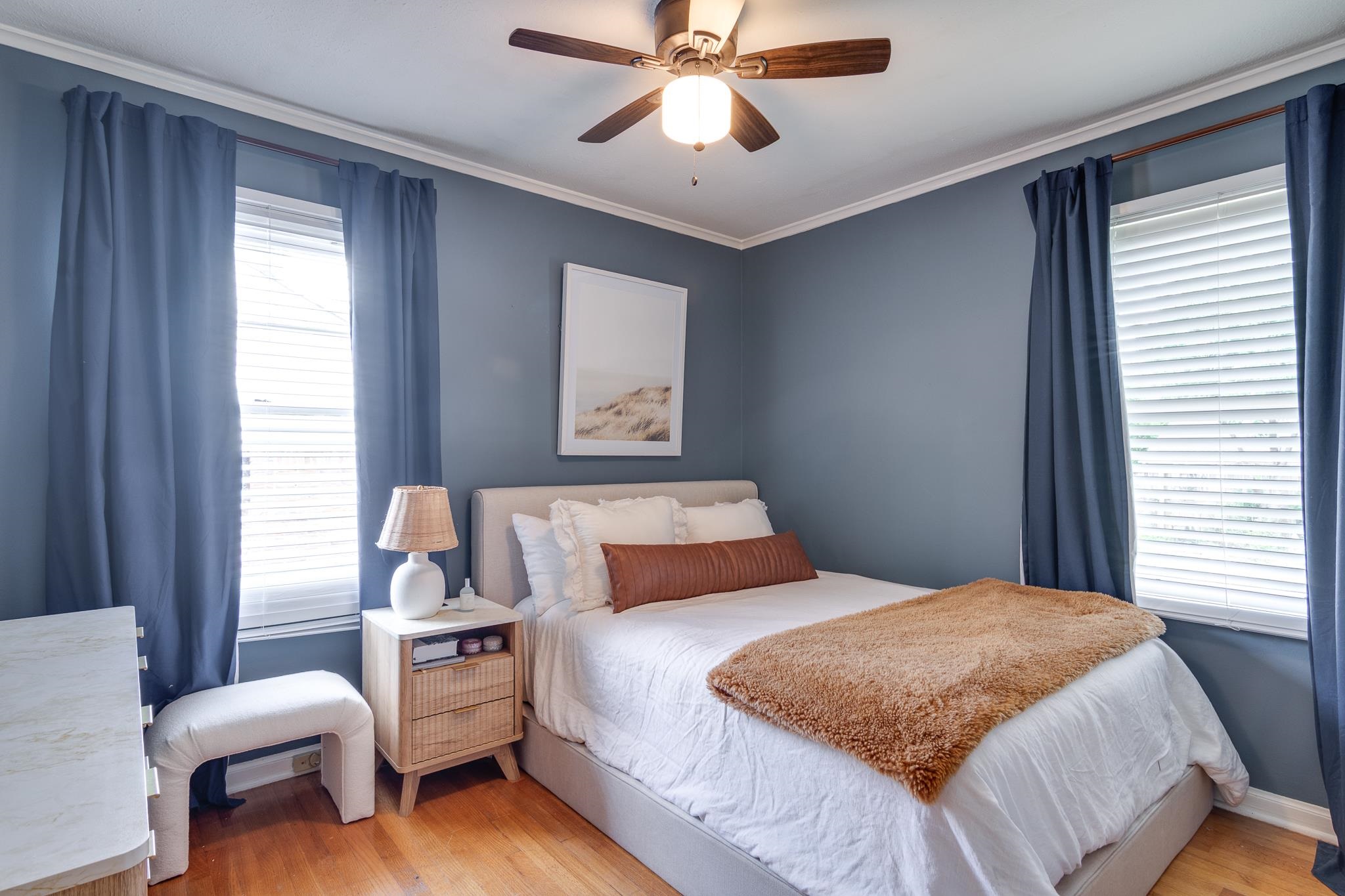 4952 Mockingbird Lane Memphis, TN 38117 - Photo 21 of 28 a bedroom with a bed and a chandelier