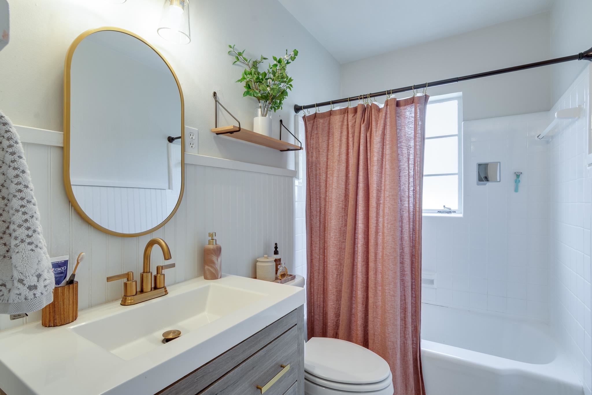 4952 Mockingbird Lane Memphis, TN 38117 - Photo 22 of 28 a bathroom with a sink mirror and a toilet