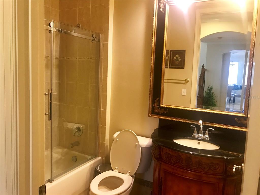 9543 Campi Drive Lake Worth, FL 33467 - Photo 19 of 23 a bathroom with a sink and a mirror