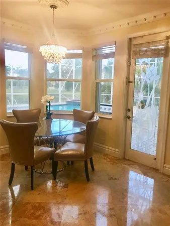 a dining room with furniture and window