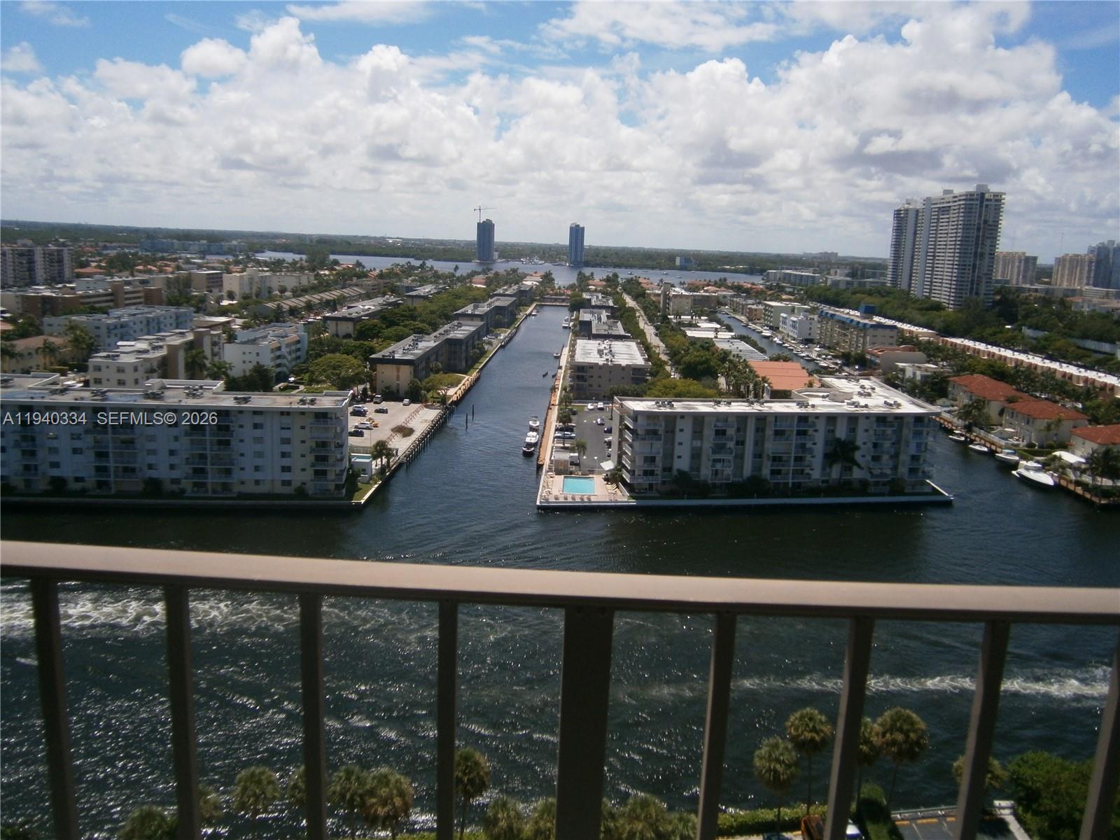 290 174th Street, Unit 1908 Sunny Isles Beach, FL 33160 - Photo 15 of 29 a view of a balcony with wooden floor