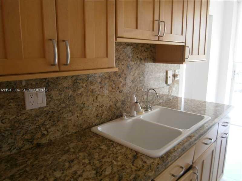 290 174th Street, Unit 1908 Sunny Isles Beach, FL 33160 - Photo 16 of 29 a bathroom with a sink