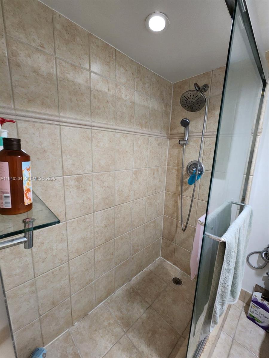 290 174th Street, Unit 1908 Sunny Isles Beach, FL 33160 - Photo 24 of 29 a bathroom with a shower
